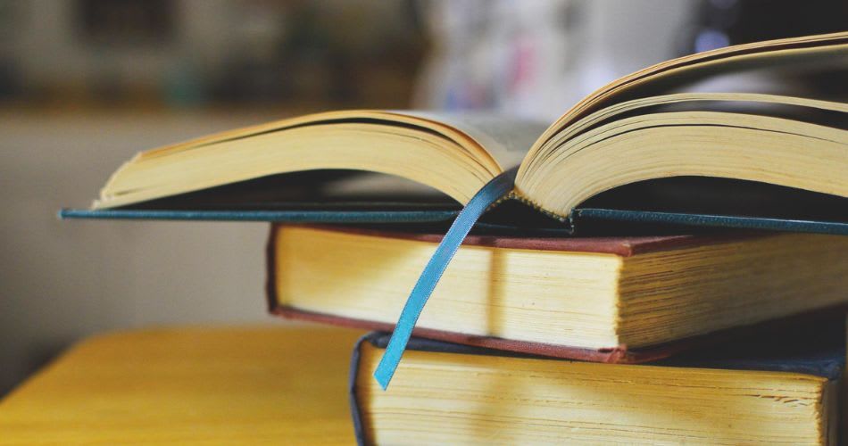 CLAT PG preparation 2026 – complete guide with tips and strategy for exam Student studying law books for CLAT PG preparation 2026 with tips, strategy, and recommended resources